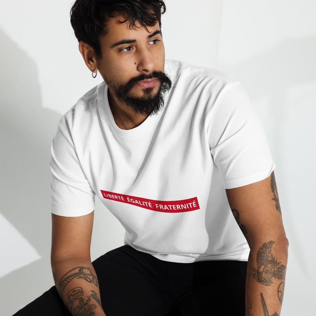 Man wearing "Liberté Égalité Fraternité" White T-Shirt