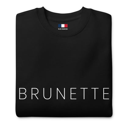 Close up of black sweatshirt with "brunette" printed on the front