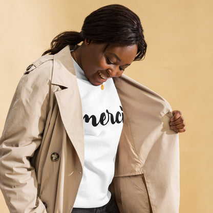 Woman in blazer wearing white Merci sweatshirt