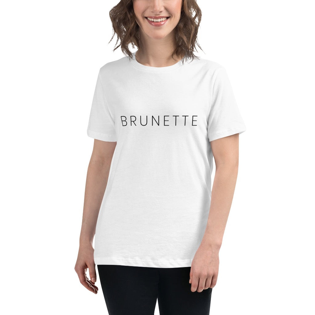 Woman wearing white t-shirt with "Brunette" printed on the front 