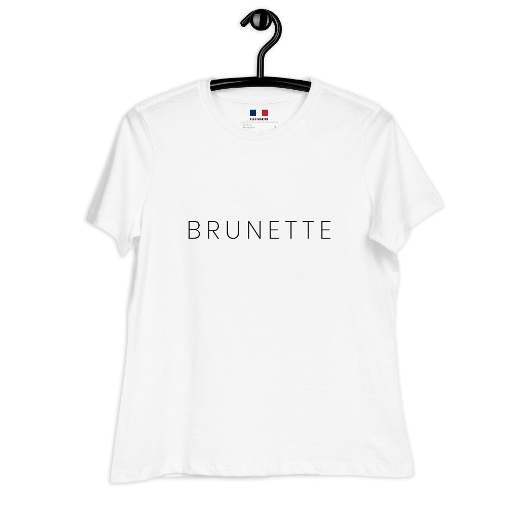 White T-shirt with "Brunette" printed on the front sitting on a hanger